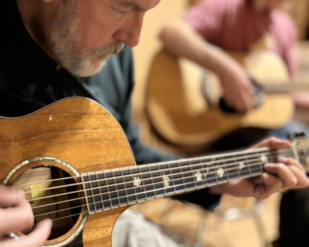 Perry playing at a jam session Island City Acoustics