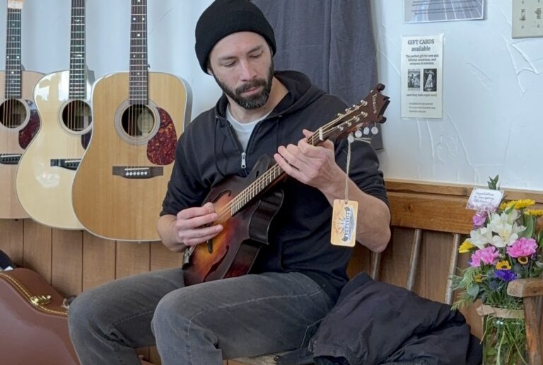 Bob playing an octave mandolin at Island City Acoustics