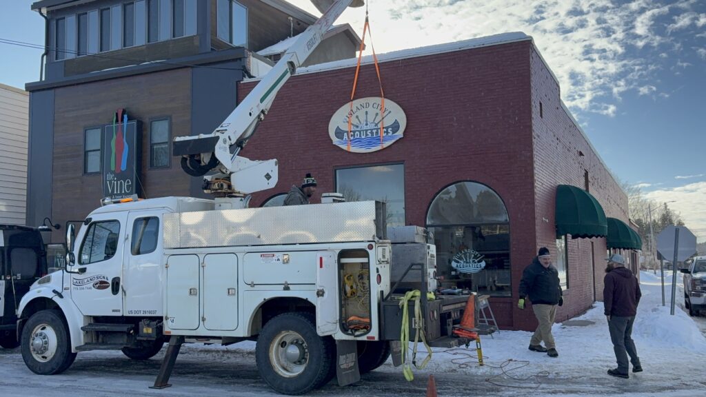 island city acoustics front shop with signage hanging